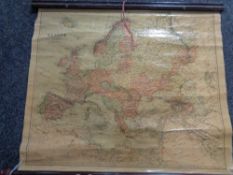 A 20th century rolled pull down map of North Africa and Europe.