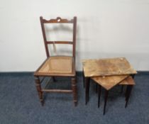 An Edwardian bergere seated bedroom chair together with a nest of three mid century tables