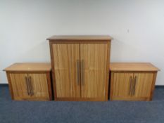 A good quality contemporary double door cabinet together with pair of matching side cabinets in a