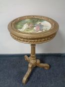 A continental gilt wood pedestal wine table with painted porcelain top signed A Schrub