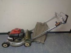 A Honda HR215 self drive petrol lawn mower