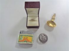 A brass caddy spoon together with Dragon lighter, military service badge.