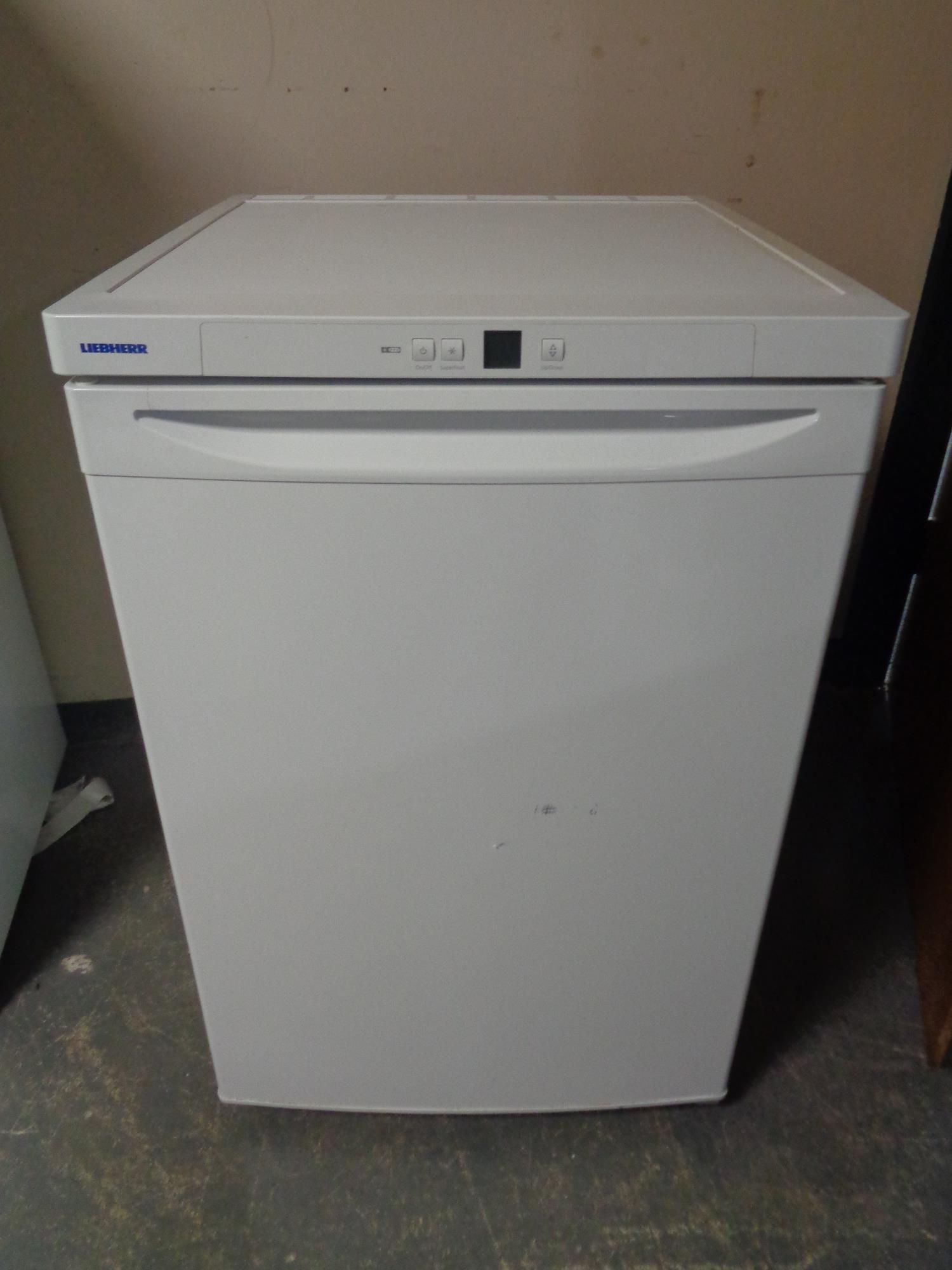 An Liebherr underbench freezer together with a Delonghi microwave