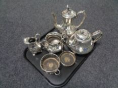 A tray containing a four piece plated tea service together with two plated wine coasters.