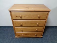 A pine four drawer chest