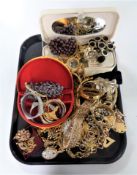 A tray containing a large quantity of assorted costume jewellery.