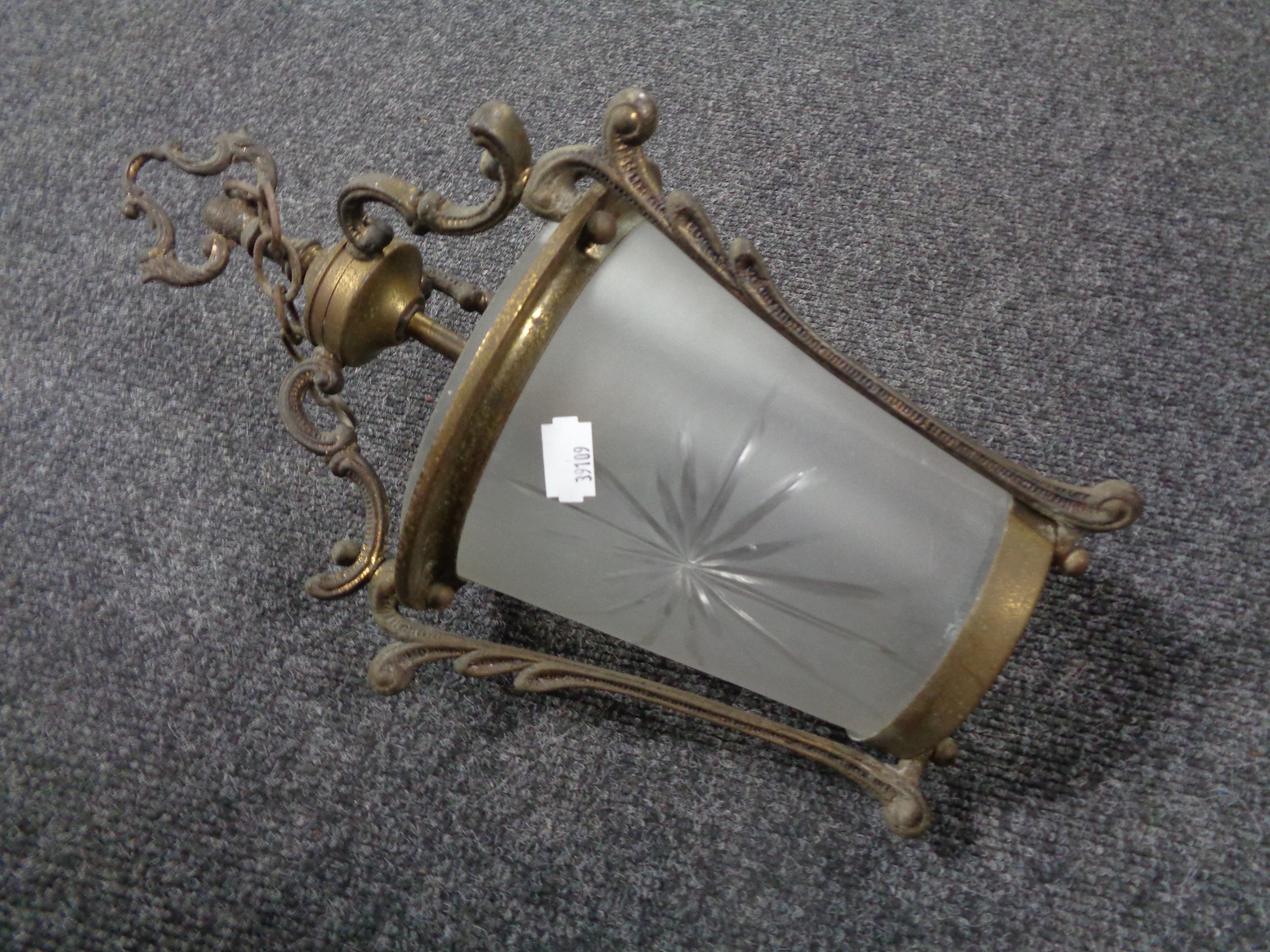 An antique brass hanging gas light fitting with opaque etched glass shade (converted).