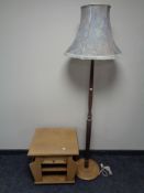 A beech standard lamp with shade together with a magazine occasional table fitted a drawer