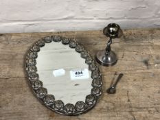 An oval silver mirror decorated with roses together with a silver mustard spoon and continental