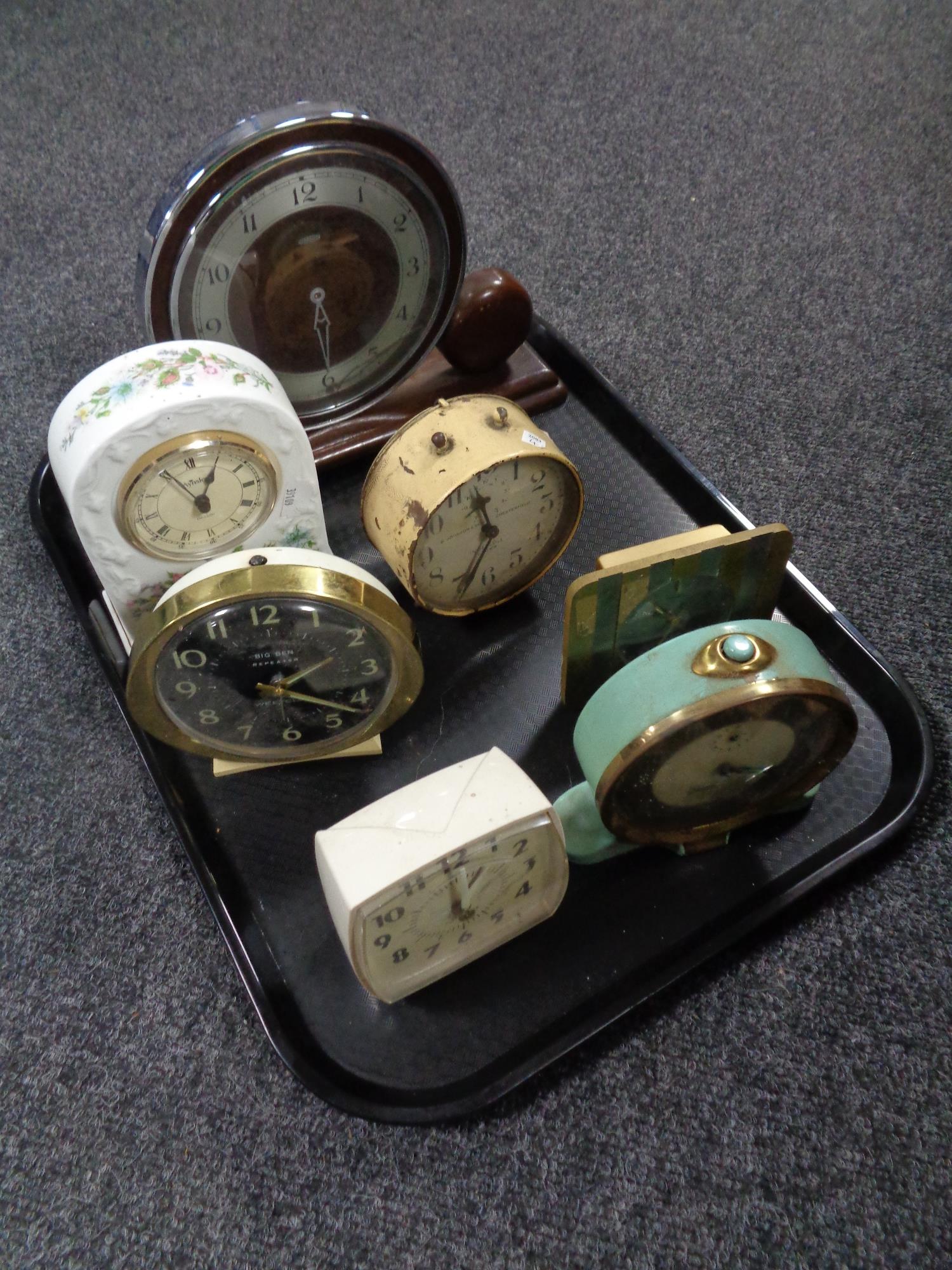 A tray containing seven 20th century and later clocks to include Smith's alarm clock,