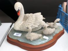 A Border Fine Arts figure, Graceful Swans A0190 by Russell Willis, on wooden stand.