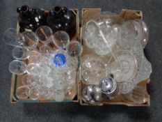 Two boxes containing assorted glassware to include demijohns, drinking glasses, punch bowl,