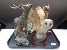 Three Leonardo owl ornaments together with a further figure of a stag.