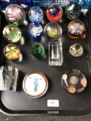 A tray containing 14 assorted glass paperweights together with a further resin paperweight