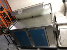 An Multi Gen stainless steel hot food counter with cupboards beneath