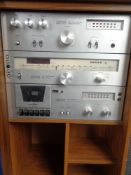 An Amstrad Hi-Fi system in case comprising stereo amplifier,