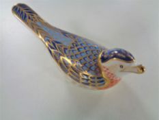 A Royal Crown Derby bird paperweight with gold stopper.