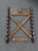 A carved oak gun rack