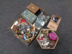 A box containing a large quantity of assorted costume jewellery and jewellery boxes.