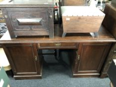 A nineteenth century kneehole pedestal desk fitted a drawer