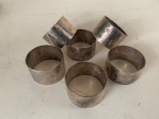 Six silver napkin rings, 202.4g.