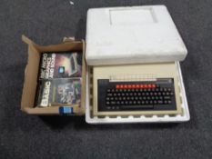 An Acorn BBC micro computer system in original polystyrene packaging together with a box containing