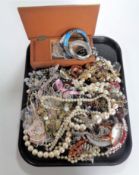 A tray containing a large quantity of assorted costume jewellery.
