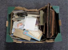 A box containing antiquarian and later postcards and monochrome photographs in albums.