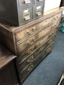A George III oak secretaire chest with brass drop handles