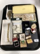 A tray containing costume jewellery to include gents gold plated ring, silver rings, necklaces,