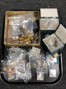 A tray containing trinket boxes containing large quantity of assorted costume jewellery,