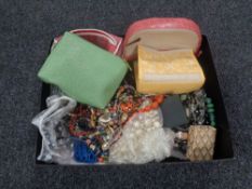 A box containing a large quantity of assorted costume jewellery, makeup bags, sunglasses etc.