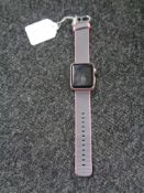 An Apple wrist watch, Series 7000, serial FH7QG6T8GR79, on pink strap. (Untested).