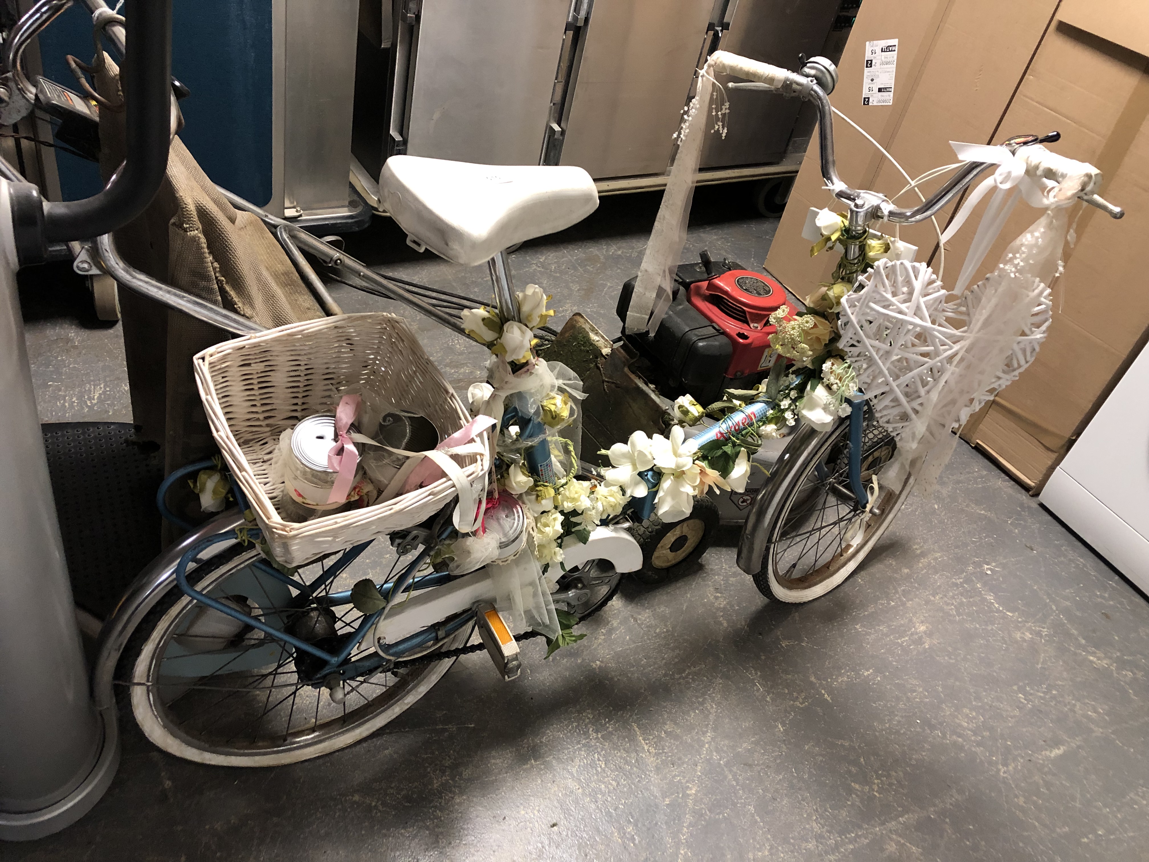 A vintage Arden Lady's folding bicycle decorated with flowers