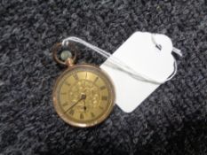 A yellow metal fob watch,