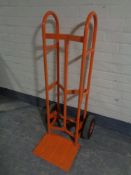 A heavy duty twin handled sack barrow with spring axle