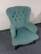 A Victorian style lady's armchair upholstered in turquoise dralon