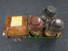 Three vintage Tilley and Coleman lamps together with a wooden railway ticket machine case.