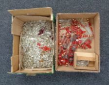 Two boxes containing a large quantity of crystal drops and beads.