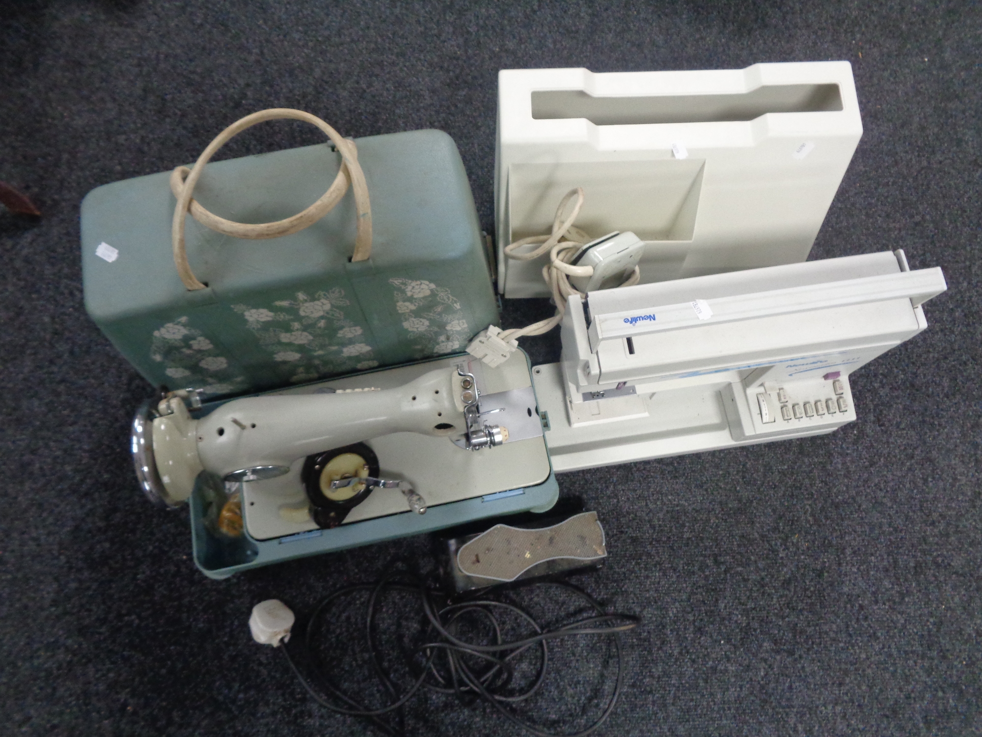 A cased new life Sewmatic 1111 electric sewing machine with foot pedal in case together with a