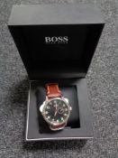A Gentleman's Hugo Boss wrist watch on brown leather strap, with retail box and care booklet.