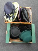 Two boxes containing assorted lady's hats.