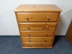 A pine five drawer chest