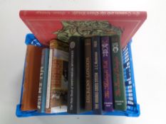 A box containing nine Folio Society volumes to include Bill Bryson, John Mansfield, Kingsley Amis.