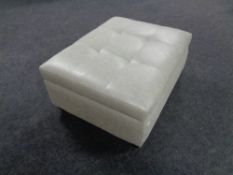 A contemporary oversized footstool