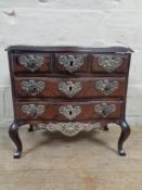 A 19th century rosewood jewellery box in the form of a six drawer chest on cabriole legs with white