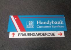 A German metal enamelled sign Frauengarderobe (Women's Wardrobe) and a perspex Co-operative Bank