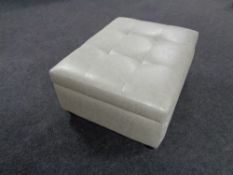 A contemporary oversized footstool