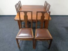 A nineteenth century mahogany wind out dining table together with a set of six later dining chairs