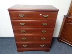 A five drawer chest in mahogany finish